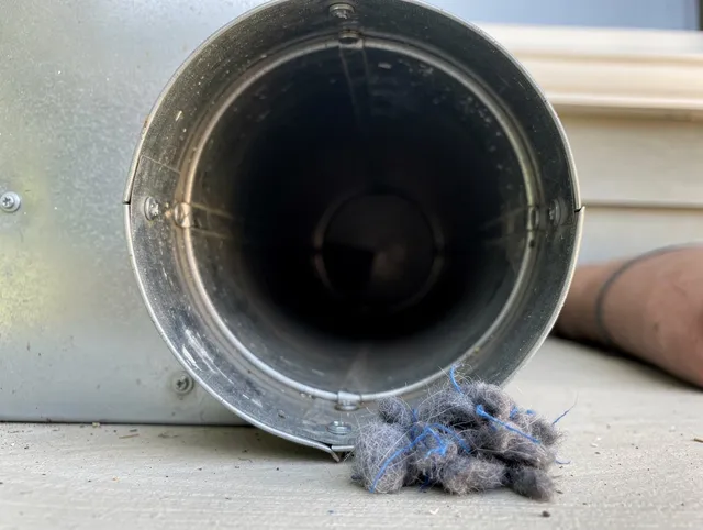 Medina Dryer Vent Cleaning technician using specialized equipment to clear severe dryer vent blockage in Medina